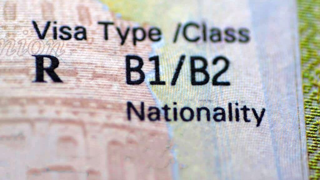 Extreme close-up of a United States visa document showing the header "Visa Type /Class" with "R" under Visa Type and "B1/B2" under Class, with the word "Nationality" visible below